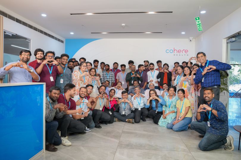 Former ZignaAI team members pose for a group photo in Cohere Health's office